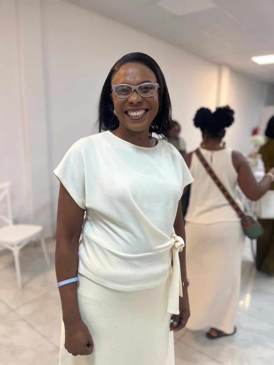 Mom smiling in a cream wrap outfit