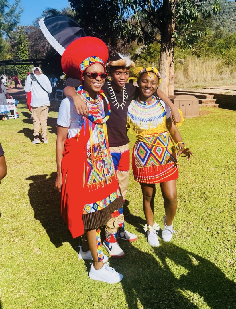 Mom in traditional Zulu attire with her son